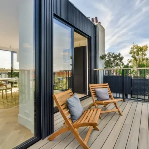bright-balcony-with-chair-and-door-2025-02-10-11-18-36-utc
